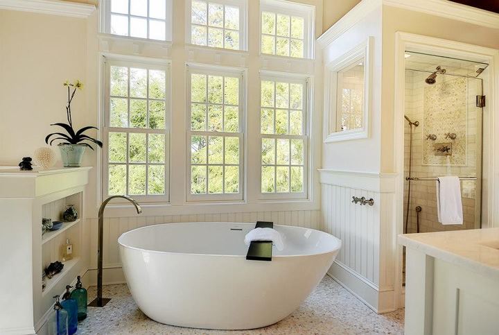 Custom bathroom with freestanding soaking tub and tiled shower